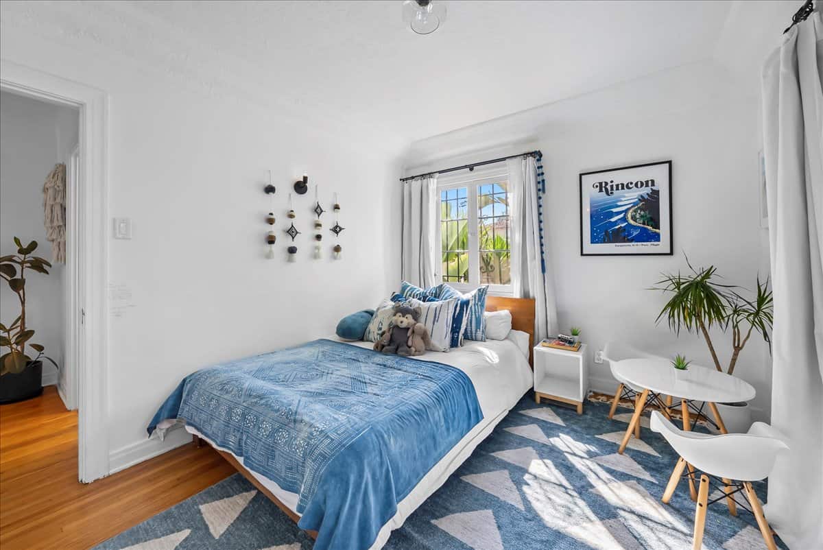 small bedroom with blue decor