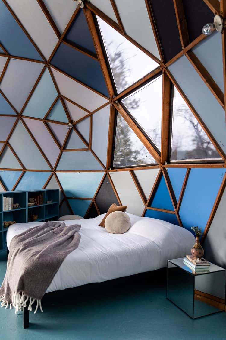 unique bedroom with blue hues inside a geodesic dome house in Los Angeles