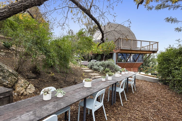 exterior and garden of the geodesic dome house called The Domestead