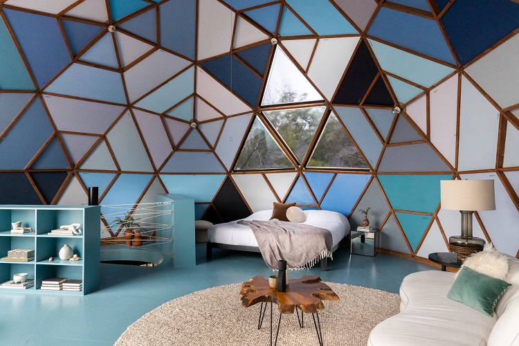 unique bedroom with blue hues inside a geodesic dome house in Los Angeles