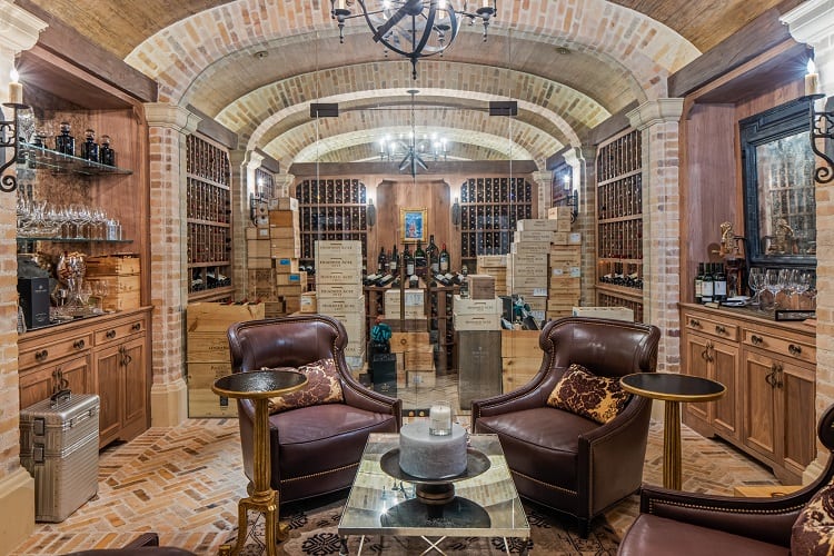 Wine/cigar cellar with a smoking lounge on the lower level. 