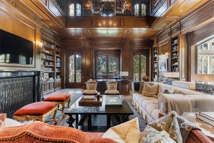 A two-story paneled library inside Mark Wahlberg's mansion. 