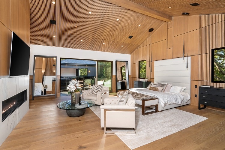primary bedroom suite with warm wood interiors