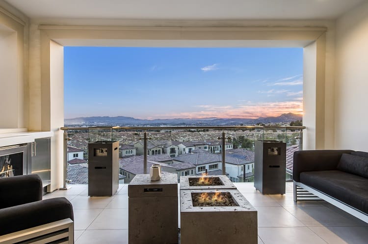 seating area with firepit, fireplace and views over the valley