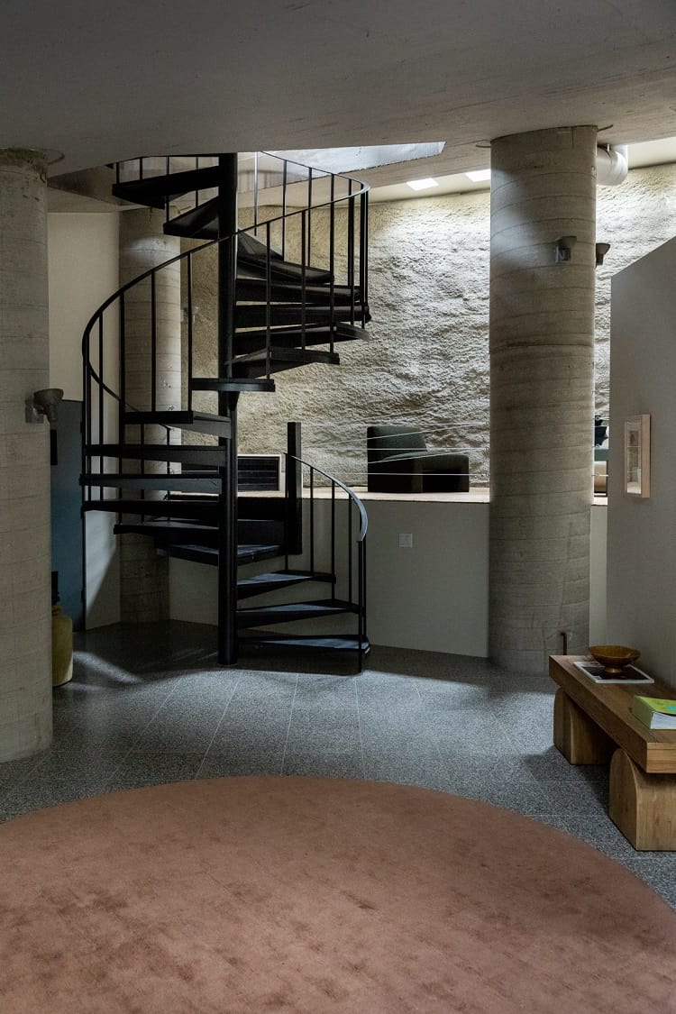 spiral staircase in the basement of a dome house