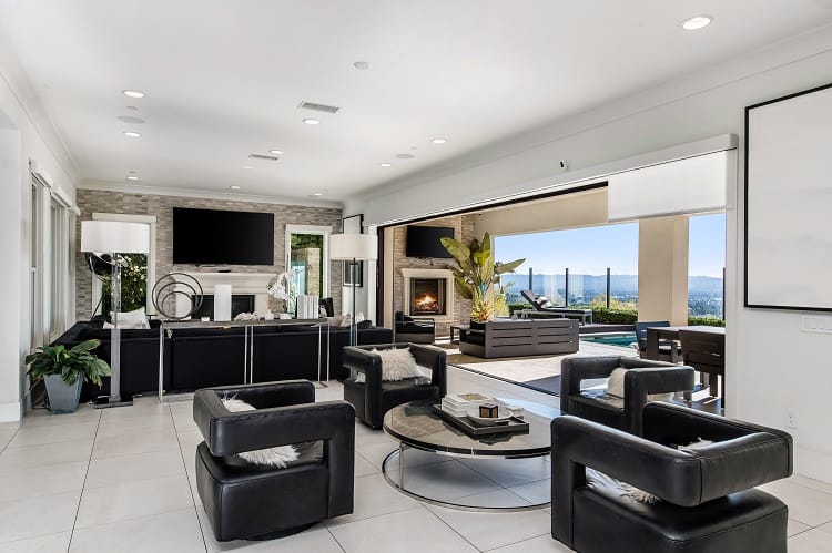 living room with fireplace inside Xzibit's house