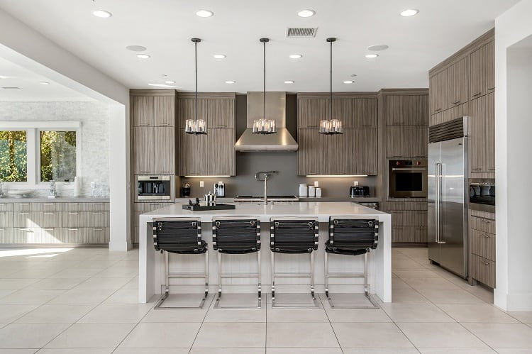 elegant kitchen with warm wood inside Xzibit's house