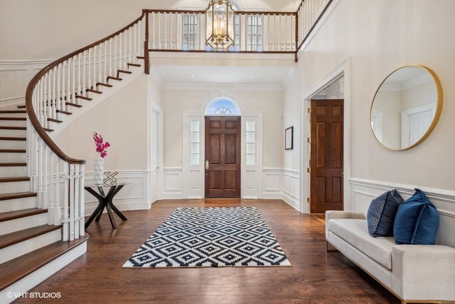 two-story entrance with curved staircase