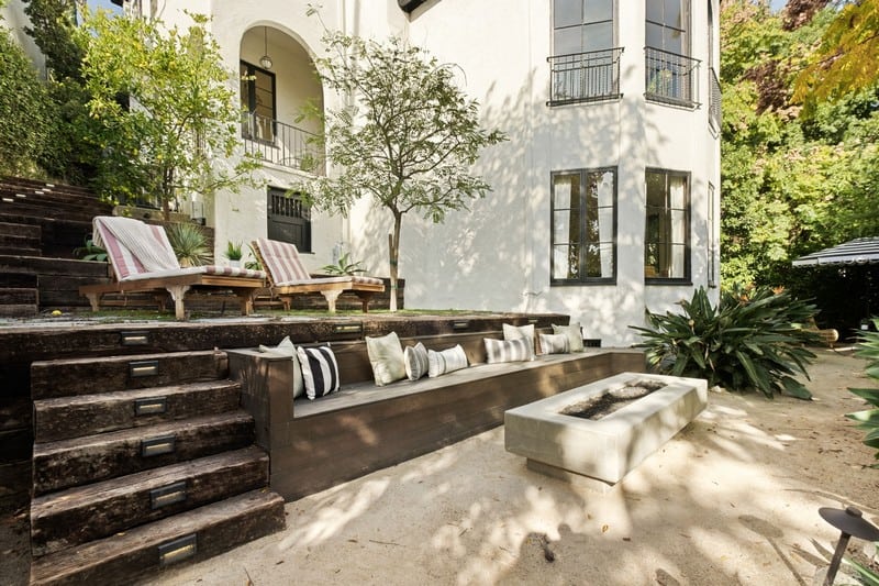 outdoor deck with seating and a fire pit