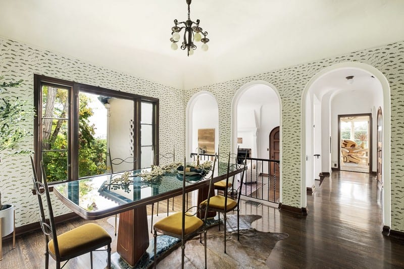 dining room with arched doorways