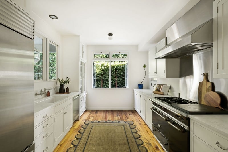 kitchen with window opening to a green area