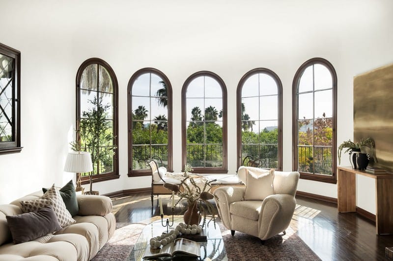 living area with rounded windows