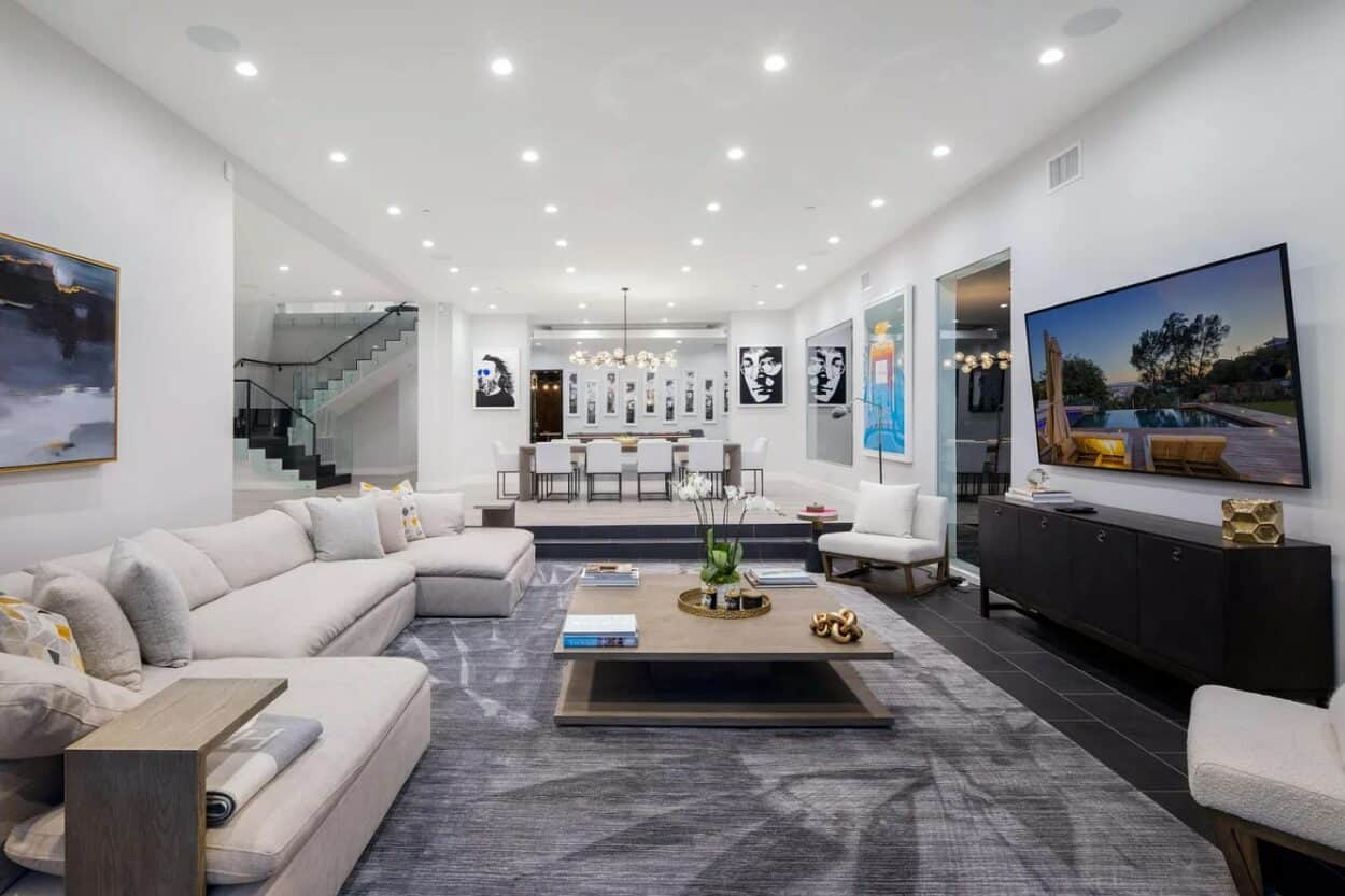 The living area inside Bad Bunny's house in Los Angeles, with the dining room in the background