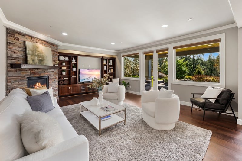 separate living area with bookshelves, TV and plenty of seating