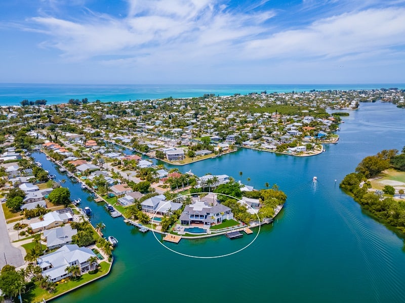 aerial view of Mark Melancon's house in Holmes Beach, FL, sitting on a waterfront lot surrounded by water