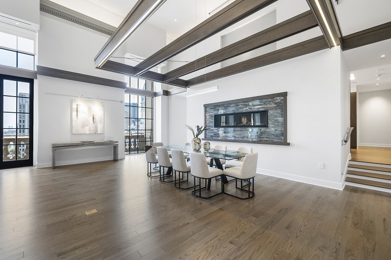 dining area with fireplace and white dining chairs