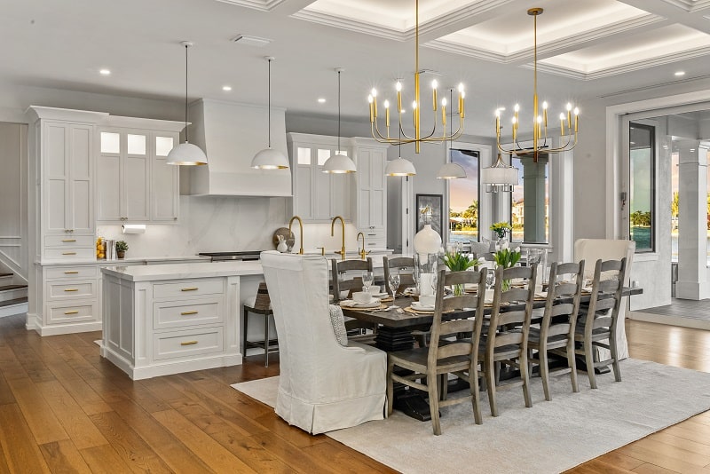 luxury dining table with a white kitchen in the background