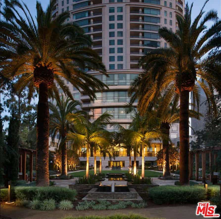 the palm tree-surrounded entrance to The Century building, where Denzel Washington's penthouse is located. 