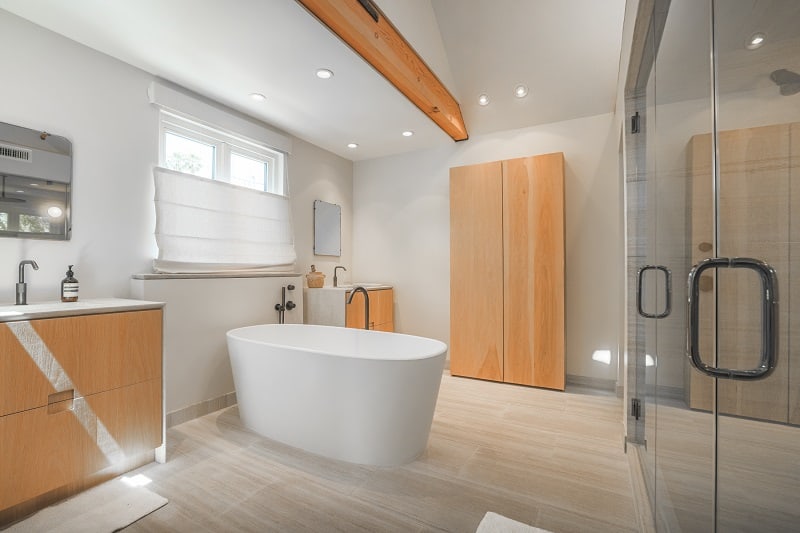 minimalist bathroom with a freestanding tub in the middle