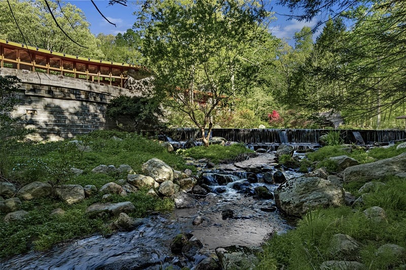 creek, stones and a small waterfall surrounding Frank Lloyd Wright's project, the Tirranna House in New Canaan, CT