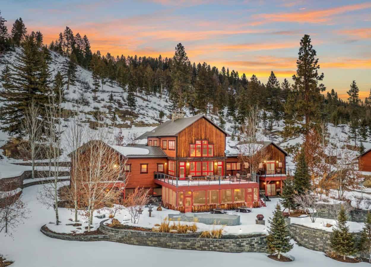 massive three-story log lodge at the Five Ranges Ranch in Montana