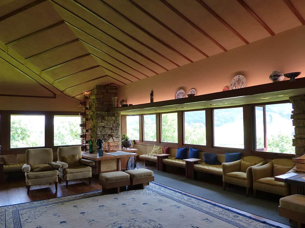 Inside Taliesin, arguably the most impressive of Frank Lloyd Wright's houses. Pictured here: the living room of the imposing property, with vaulted ceilings and many chairs for visitors