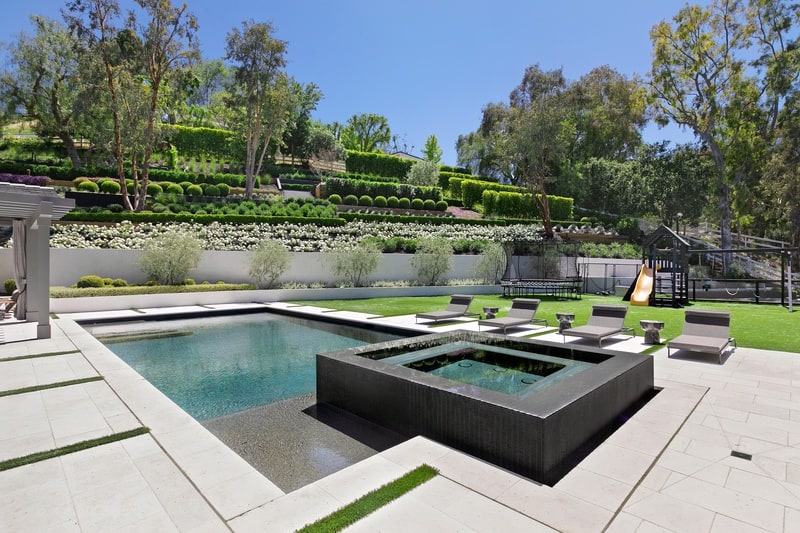 pool with hot tub overlooking the terraced gardens