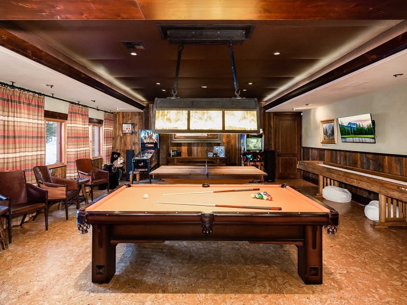 large game room in the basements with a billiards table and ping pong