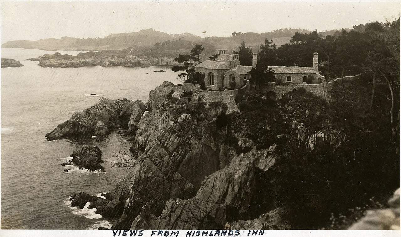 old black and white photo showing the DL James house Carmel, CA perched high on a cliff overlooking the sea