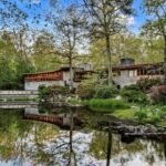 Tirranna, a Frank Lloyd Wright-designed house in New Canaan, CT. The house is shaped like a horse shoe and sits in front of water