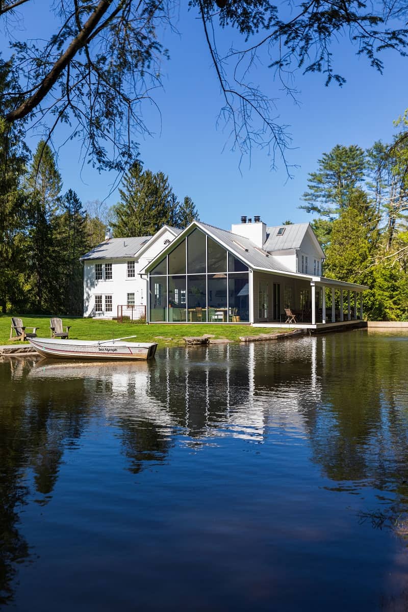 The Floating Farmhouse in Eldred, NY with the pond in front of it