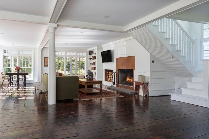 Living area with fireplace inside the Floating Farmhouse in Eldred, NY. 