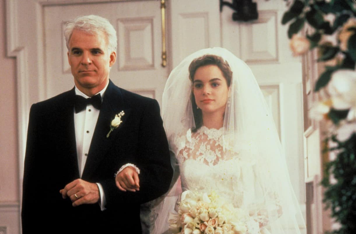 Still from the 1991 movie Father of the Bride, with Steve Martin and Kimberly Williams-Paisley walking down the isle. 