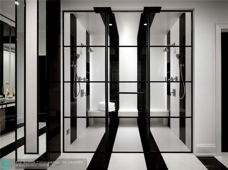 Black and white walk-in shower inside Lionel Messi's house in Fort Lauderdale, Florida