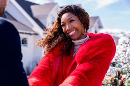 Brandy Norwood as Jackie in Best. Christmas. Ever!, standing in front of the house. Photo credit: Scott Everett White/Netflix © 2023.