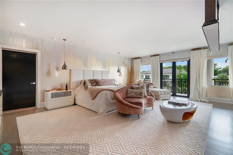 Primary bedroom with gold dripping wallpaper inside Lionel Messi's house in Fort Lauderdale, Florida