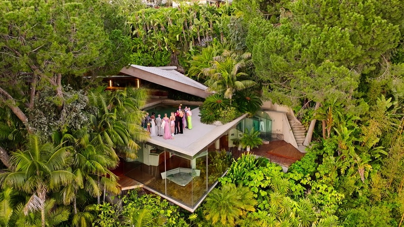 Selling Sunset. (L to R) Romain Bonnet, Mary Fitzgerald, Chelsea Lazkani, Jason Oppenheim, Nicole Young, Marie-Lou Nurk, Amanza Smith, Emma Hernan, Austin Victoria, Alex Hall, Gio Helou, Alexandra Jarvis in season 7 of Selling Sunset at the Sheats-Goldstein residence in Los Angeles. Cr. Courtesy of Netflix © 2023