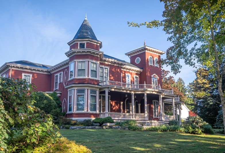 Side view of Stephen King`s house in Bangor, Maine, with red brick exterior and a Victorian design