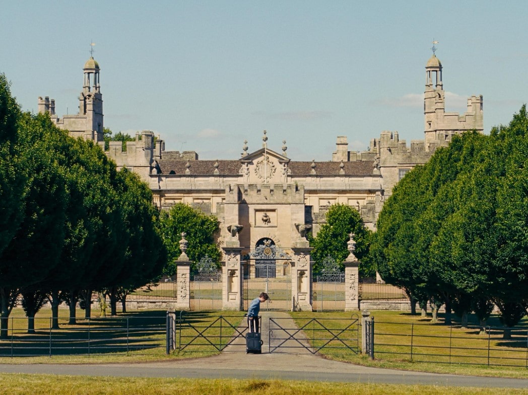 Oliver (Barry Keoghan) arriving at Saltburn, played by Northamptonshire's historic Drayton House.