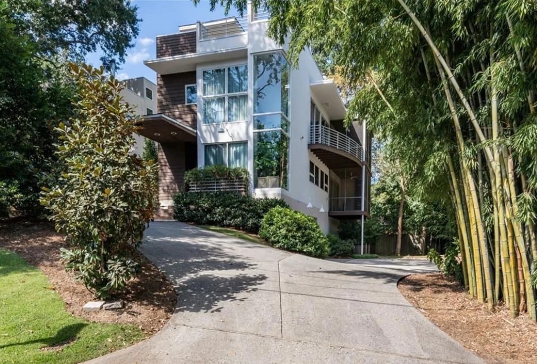 the exterior and driveway of a three-bedroom house Usher owned in Atlanta.