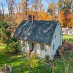 New England Cape Cod 'Bow House' in New Jersey's Delaware County. Photo by Motion City Media