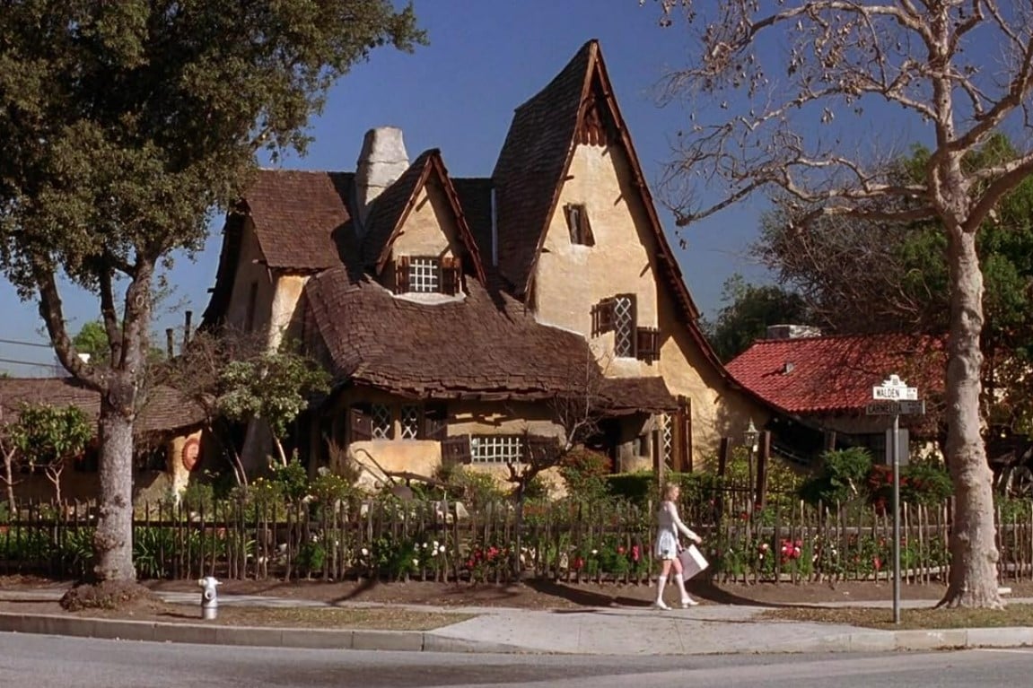 Cher walking past the unique storybook house known as The Spadena House