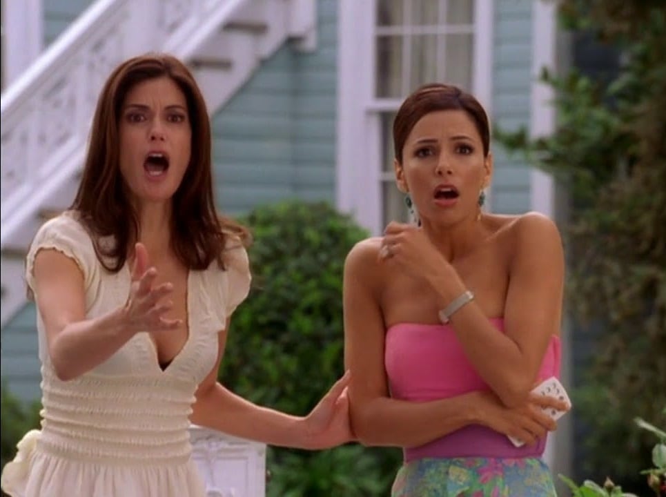 Two of the leading ladies of Wisteria Lane standing outside of the house. 