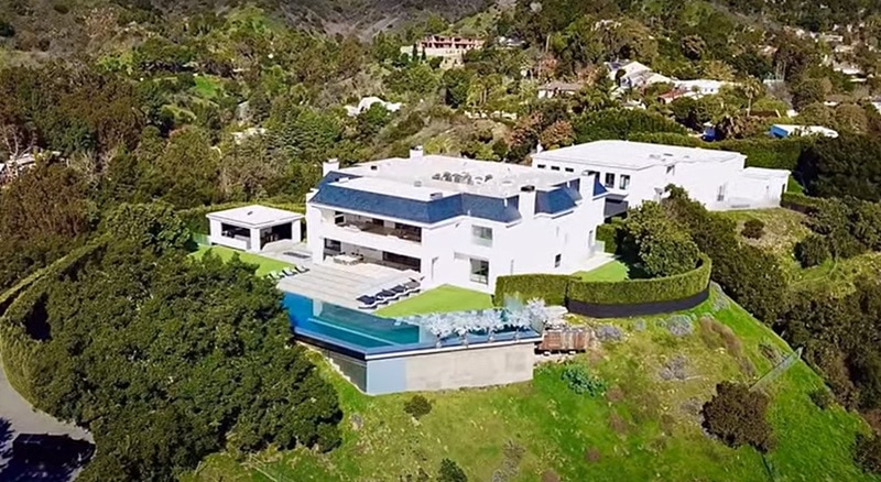 Aerial view of Ben Affleck and Jennifer Lopez's house in Beverly Hills, a two-story mansion with French-inspired architecture modeled after Le Petit Trianon. Photo credit: Youtube