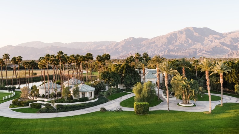 view of the guest pods and pathways on the property with the mountains in the background