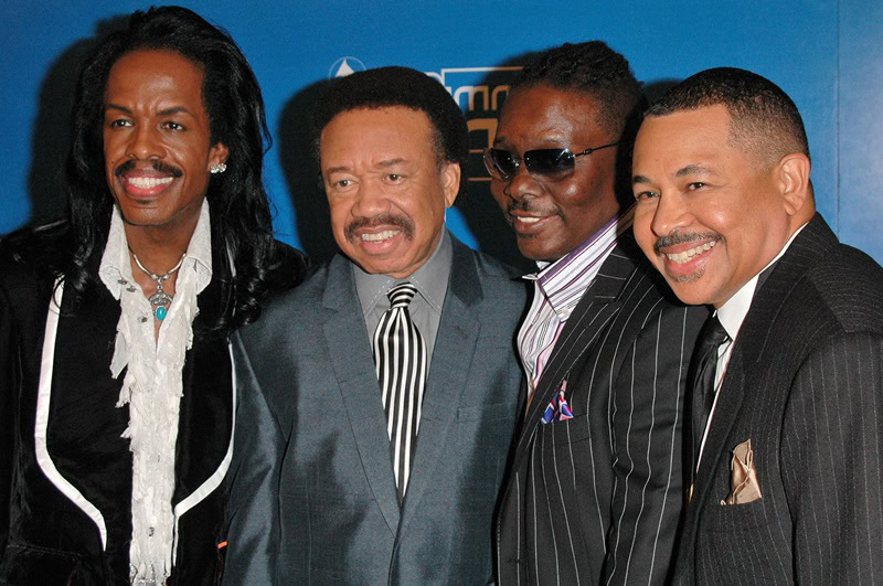 All four Earth, Wind and Fire band members at the Inaugural GRAMMY Jam Event, posing for a photo while wearing suits at the Wiltern LG Theater in Los Angeles.