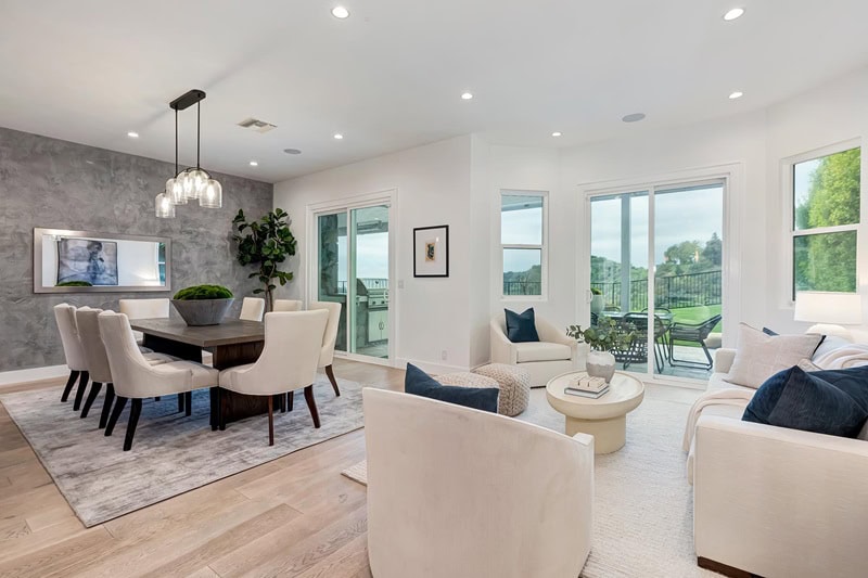 bright dining area with seating and a large windows