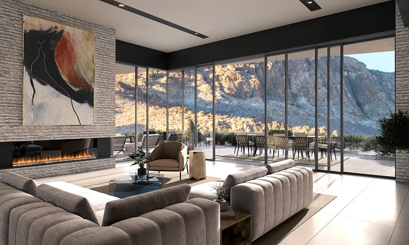 Rendering showing the living room of an Ascaya house, with a large corner sofa, a fireplace, and large floor-to-ceiling windows overlooking a mountainous backdrop