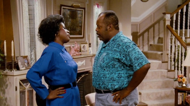 Inside the Winslow home from Family Matters, with the main characters talking, with the staircase visible in the back.