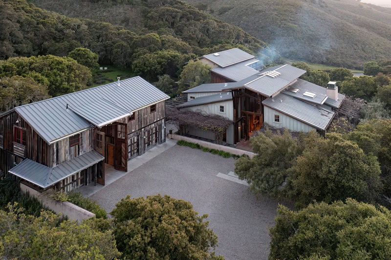 the structures on the property, one being the main house, with the other a barn from reclaimed wood.